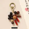 Nuevo colgante de bolsa de cuentas de semillas que cumple deseos estilo chino, llavero de Bodhi natural tejido a mano, decoración artística retro para bolsa