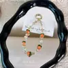 Colgante para cadena de teléfono con tema de caqui, llavero con cuentas de cristal, accesorio para funda de teléfono, accesorio para bolso, venta al por mayor de regalos pequeños