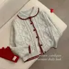 Chic estilo coreano dulce suave forma de corazón reductor de edad cuello de muñeca retro tejido de punto trenzado cardigan holgado prendas de punto suéter mujer