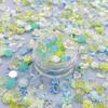 Transmisión en vivo de nueva joyería para arte de uñas verde luminoso campo azul y verde luna de amor Camelia hada bolsa de materiales para arte de uñas