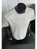 Camiseta de manga corta con corte tridimensional de patchwork deconstruido de la alta calle americana para hombre, marca de moda de verano, top elegante y sofisticado de media manga