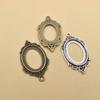 Accesorios de aleación 3.6g Marco central ovalado 18x 25 gema de tiempo colgante inferior fabricante