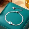 Pulsera de acero de titanio de cuerpo entero de venta caliente transfronteriza para mujer, temperamento de lujo ligero, coreana, galvanoplastia de oro real de 18K, venta al por mayor de joyería
