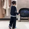 Conjunto de sudadera para niña, primavera y otoño 2026 nuevo estilo coreano, elegante sudadera con lazo y pantalón de chándal conjunto de dos piezas, moda transfronteriza