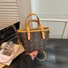 Bolso tipo cubo bolso de mano pequeño para mujer, nuevo bolso tote tipo cesta de verano 2026 con textura, bolso de hombro versátil
