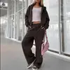 Colección de otoño nueva para exportación europea y americana 2026: conjunto de sudadera corta de color liso con cremallera y pantalones de pierna ancha, estilo casual deportivo