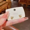 Pendientes de botón con forma de corazón de circón microincrustado, delicados y exquisitos, para mujer, moda de nicho de lujo ligero, pendientes de corazón versátiles y elegantes para ir al trabajo