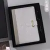 Cuaderno grueso A5 con logo imprimible innovador, alto valor de color, traje de caja de regalo de negocios, venta al por mayor