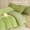 Juego de ropa de cama de cuatro piezas de imitación de piel de conejo y terciopelo de leche para invierno, nuevo juego de tres piezas de sábana y sábana bajera de felpa gruesa y cálida