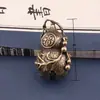Nuevo Kong Bell Corazón Sutra Bell Cabeza de León Bell Llavero de Coche Colgante Colgante Pequeño para Bolso Venta al por Mayor