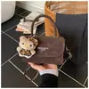 Bolso Pequeño Cuadrado Retro Estilo Hong Kong Hombro Único 2026 Nuevo de Moda Diseño de Nicho Moda Color Sólido Bolso de Hombro Cruzado de Alta Gama