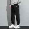 Pantalones de chándal casuales de moda para hombre para primavera y otoño, Joggers de corte holgado, Pantalones largos adelgazantes, Pantalones deportivos versátiles para el día a día para estudiantes jóvenes