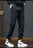 Calça de veludo cotelê transfronteiriça, calça jogger masculina da moda outono/inverno com retalhos e corte solto, calça casual masculina com forro de fleece e espessada
