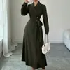 Moda Feminina Transfronteiriça Europeia e Americana Outono/Inverno 2026 Casaco Longo Estilo Terno com Gola Lapela, Mangas Longas, Cinto na Cintura e Comprimento Longo para o Dia a Dia
