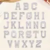 Parches Bordados de Letras Inglesas de 4.8 cm Color Plateado de Venta Caliente Transfronteriza con Adhesivo Termofusible para Decoración de Ropa y Sombreros