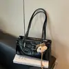 Bolso de hombro de moda nicho vintage transfronterizo para mujer 2026 nuevo modelo fresco y simple bolso de hombro para el día a día bolso de axila