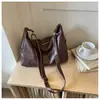 Bolsa feminina grande capacidade estilo coreano, novo modelo outono 2026, bolsa de ombro e transversal lisa e moderna, bolsa de bolinho casual para o trabalho