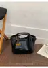 Bolso cubo de nicho vintage de alta gama para mujer, nuevo modelo 2026, bolso de hombro versátil y moderno para el día a día, bolso cruzado casual, moderno