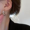Pendientes de cadena de triángulo hueco de aguja de plata metal viento frío simples pendientes Joker moda pendientes de alta gama venta al por mayor