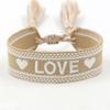 Pulsera tejida bordada con corazón de amor con borla Correa tejida ajustable Accesorios para pareja de estudiantes Venta al por mayor