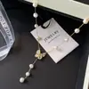 Collar de Concha de Perla con Borla de Mariposa de Flor para Mujer 2026 Nuevo de Alta Gama Lujo Ligero Nicho Cadena para Clavícula Tendencia