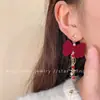 Brincos de meteoros rotativos Outono e inverno Ano Novo Brincos de laço vermelho Design de nicho doce Sense Ear Clip Mulheres