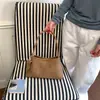 Bolsa de axila com textura tecida de luxo leve estilo francês para mulheres, novo modelo 2026, bolsa de mão elegante, bolsa de ombro, bolsa baguette para o dia a dia
