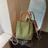 Bolso de mano de cuadros de nicho estilo coreano para mujer, nueva moda primavera 2026, simple y elegante, bolso de hombro y cruzado de alta gama