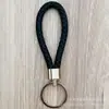 Llavero de cuerda de cuero trenzado simple creativo colgante de muñeca linda accesorios de llave para parejas tendencia regalos pequeños venta al por mayor
