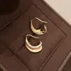Pendientes de Aro Curvos de Metal con Circonita Estilo Europeo y Americano, Pendientes de Diseño Único de Nicho Personalizados y de Moda, Pendientes de Lujo Ligero y de Alta Gama