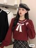 Otoño e Invierno 2023 nuevo suéter de cuello redondo manga abullonada Jacquard de lazo suelto estilo occidental top suave y lindo para mujer