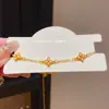 Pulseira de Zircônia Flor de Trevo de Quatro Folhas Estilo Levemente Luxuoso Retrátil Estilo Retrô Francês Nicho Exquisito Personalizado Joias de Alto Padrão