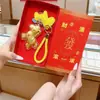 "Hazte Rico Pronto" Set de Regalo con Llavero, Colgante de Bolsa Dorada, Adorno para Cadena de Teléfono Móvil, Regalo del Año del Caballo, Superventas Transfronterizo