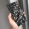 Funda de teléfono impresa pintada al por mayor no en blanco y negro pequeña floral de cristal adecuada para Samsung S25/S26 Ultra