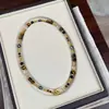 Colar de fivela de metal dourado esmagado com pérolas de água doce feminino outono e inverno Maillard Tiger Eye com miçangas costuradas corrente longa de lã