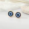 Aretes europeos vintage exquisitos de resina de color con brillo de ojos redondos, geométricos personalizados de ojo de demonio, para mujer