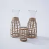 Comercio transfronterizo cubierta de botella de paja natural tejida a mano jarrón de vidrio retro adornos creativos para decoración del hogar al por mayor