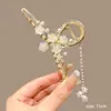 2025 Nuevo Estilo Estilo Antiguo Muguete Borla Pinza para el Cabello, Horquilla, Accesorio para el Cabello, Pinza para el Cabello, Horquilla, Tocados Venta al por Mayor