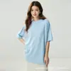 Camiseta de cachemir minimalista y relajada de manga corta para mujer, silueta holgada, cuello redondo, top de punto versátil y favorecedor.