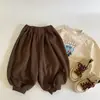 Pantalones casuales para niños estilo coreano, nueva colección otoño 2026, pantalones de tobillo cónico, corte holgado, pantalones largos versátiles para bebés