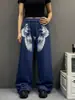 Calça de moletom niche estilo casual americano com estampa de asa e estrela em blocos de cor, calça de moletom azul solta e fluida, calça de dança jazz