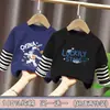 Ropa para niños para niños, camiseta de manga larga de retazos, imitación de dos piezas, camiseta base de algodón puro para niños mayores, nuevo estilo de top para primavera y otoño 2026