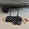 Bolso tipo baguette de un solo hombro de nicho estilo coreano, nuevo modelo otoño 2026, bolso de mano de lunares de alta apariencia para el trabajo y los desplazamientos