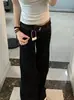 Calça jeans boca de sino de cor escura estilo americano para mulheres, novo modelo primavera e outono 2026, corte solto, não aperta nas pernas, madura e elegante, calça bootcut de cintura baixa