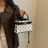 Bolsa de mão de bolinhas de nicho de alta qualidade para mulheres, nova moda 2026, versátil, com fecho de trava, de ombro e crossbody, bolsa Kelly