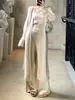 Otoño/Invierno 2026 Nuevo cárdigan largo de punto sin tirantes pantalones de pierna ancha de cintura alta conjunto de tres piezas de punto estilo perezoso con temperamento para mujer
