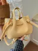 Bolso tipo cubo de color caramelo con estampado de lichi coreano para mujer, nuevo bolso tote versátil de verano 2026, bolso de hombro y cruzado para ir al trabajo