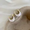 Pendientes de aro de esmalte blanco de lujo ligero y de alta gama para mujer, con un estilo francés único y moderno, pendientes versátiles y elegantes