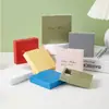 En stock película de pe antioxidante caja de suspensión sobre caja de cartón blanco caja de almacenamiento de película de pe cubierta de papel caja de joyería al por mayor