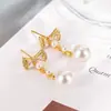 Pendientes de Lazo y Perlas de Lujo Otoño-Invierno para Mujer, Nuevos Accesorios para Orejas Populares y Únicos 2024 con un Toque de Alta Gama, Pendientes de Botón Distintivos